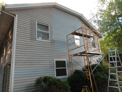 Rented scaffolding erected to reach high parts of the house.
